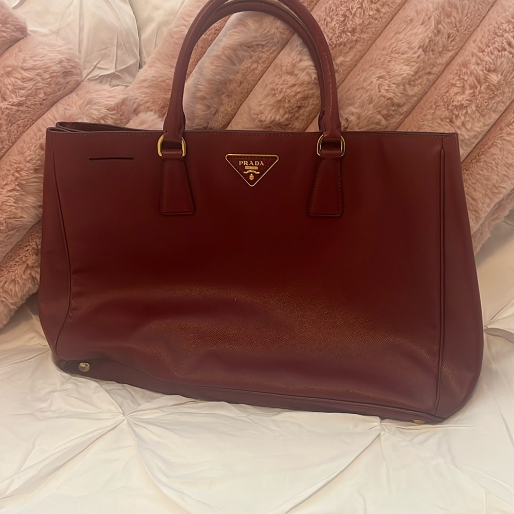 Prada burgundy saffiano leather bag (top handle). Minimally worn.